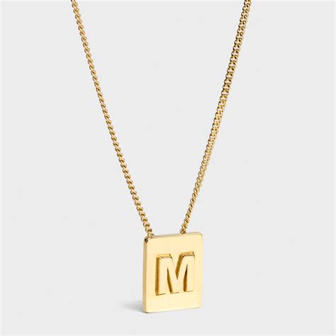 celine pendant m|Alphabet M pendant in brass .